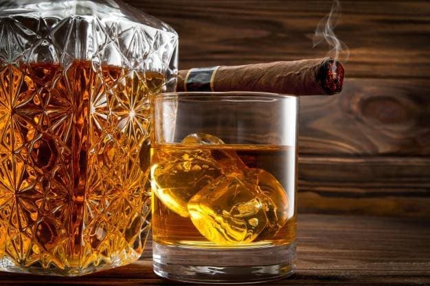 closeup-bottle-glass-with-whiskey-cigar_80510-360.jpg